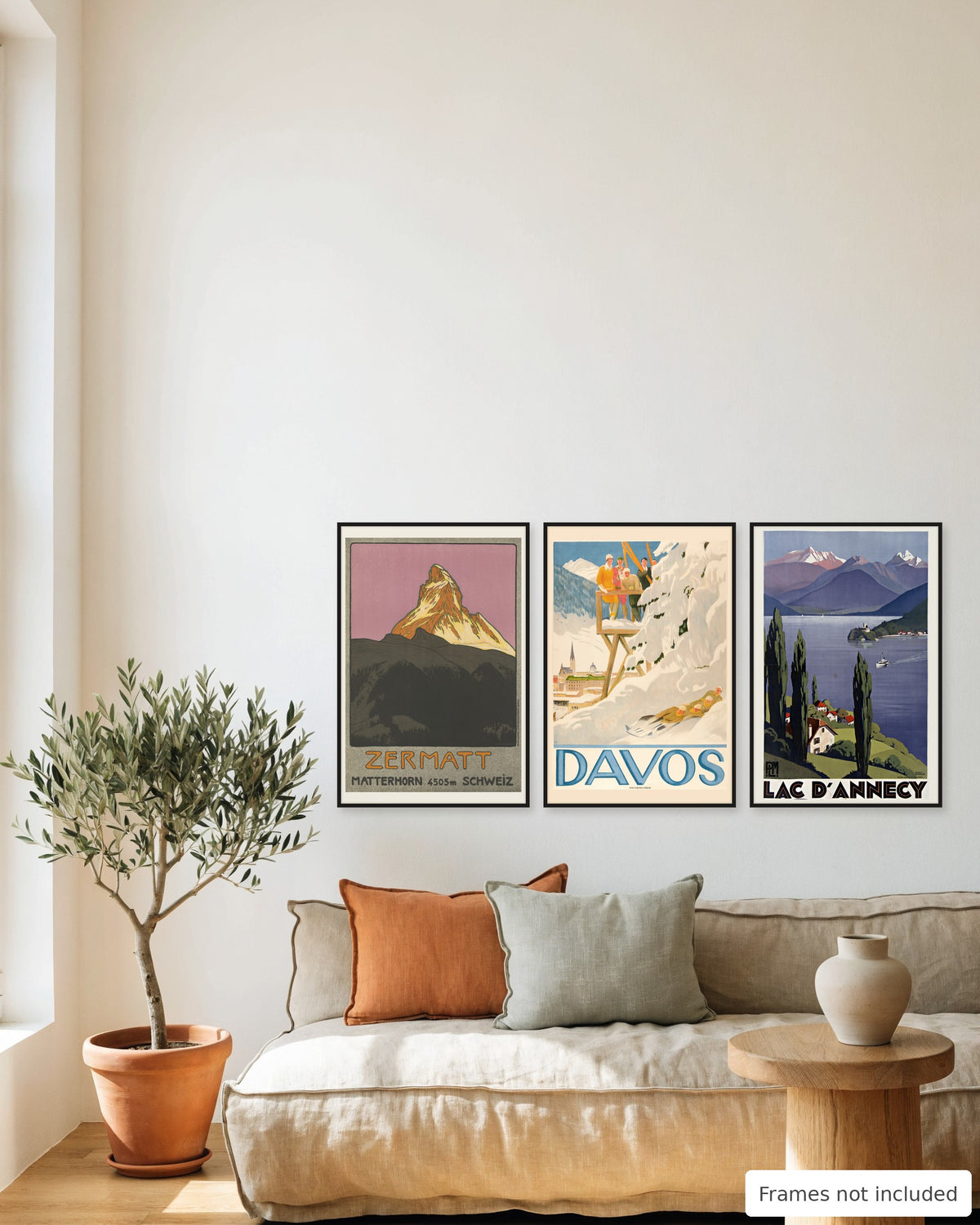 Alps vintage poster set of 3 - Zermatt, Davos and Lake Annecy framed as a gallery wall above a sofa