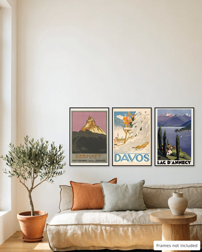Alps vintage poster set of 3 - Zermatt, Davos and Lake Annecy framed as a gallery wall above a sofa