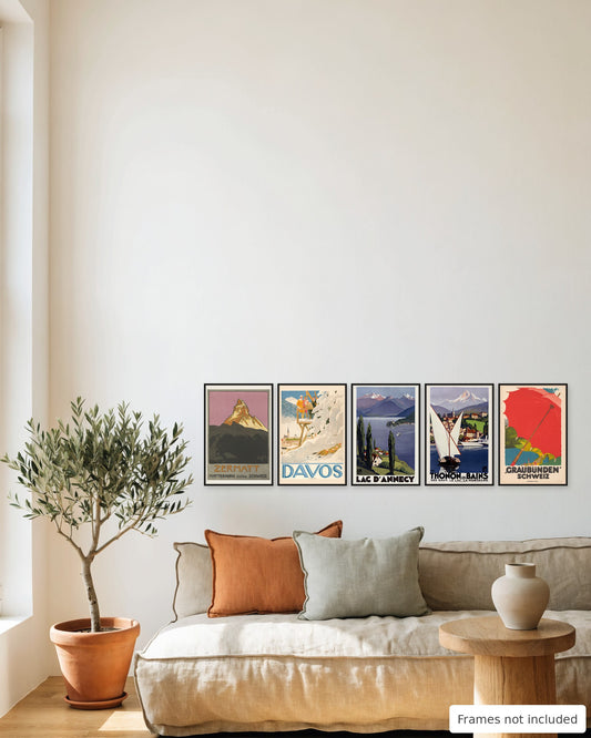 Alps vintage travel poster set of 5 hung as a gallery wall above a linen sofa
