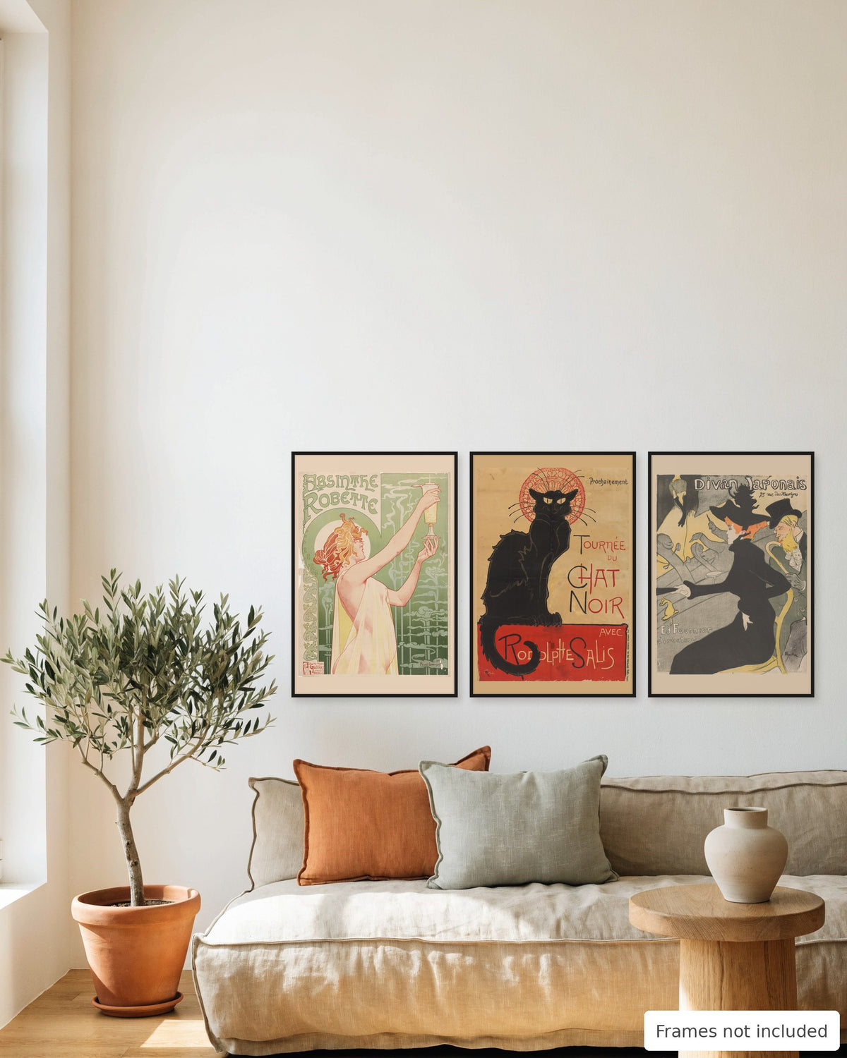 Belle Époque bar poster set of 3 - Absinthe Robette, Tournée du Chat Noir and Divan Japonais framed as a gallery wall above a sofa