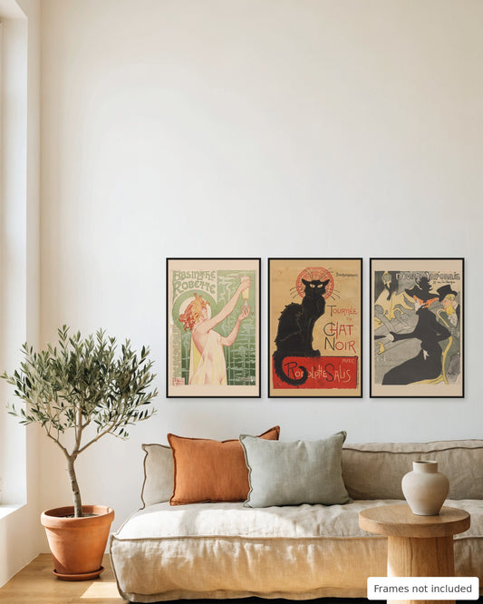 Belle Époque bar poster set of 3 - Absinthe Robette, Tournée du Chat Noir and Divan Japonais framed as a gallery wall above a sofa