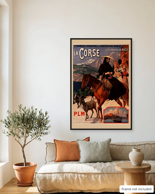 Corsica vintage travel poster (1904) framed on a living room wall above a linen sofa