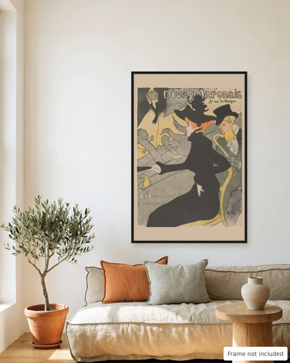 Divan Japonais poster by Toulouse-Lautrec (1893) framed on a living room wall above a linen sofa