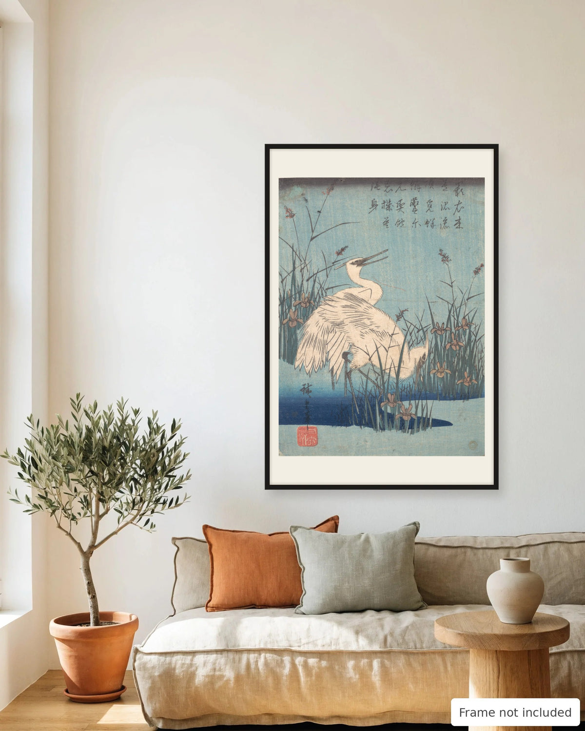 Egrets amid Irises and Grasses by Hiroshige (1830s) framed on a living room wall - frame not included
