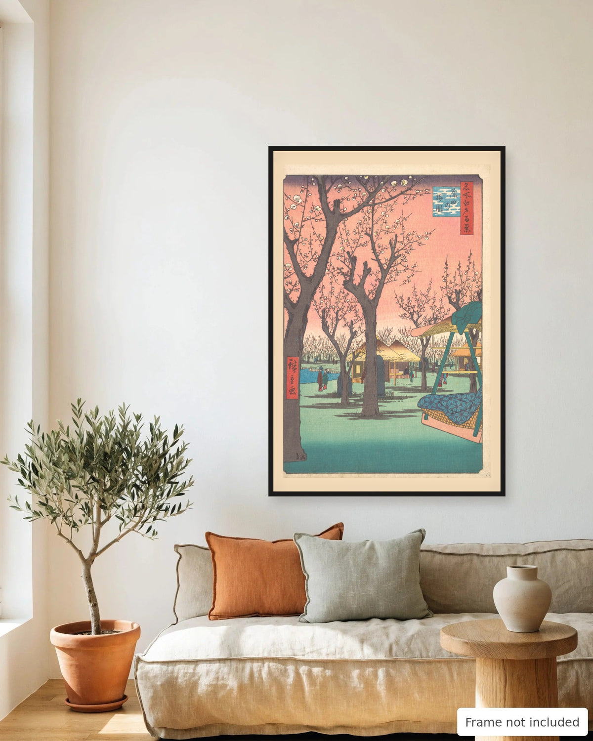 Plum Garden at Kamata by Hiroshige (1857) framed on a living room wall - frame not included