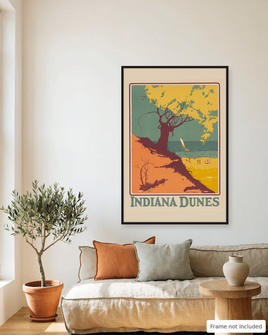 Indiana Dunes vintage travel poster (1927) framed on a living room wall above a linen sofa