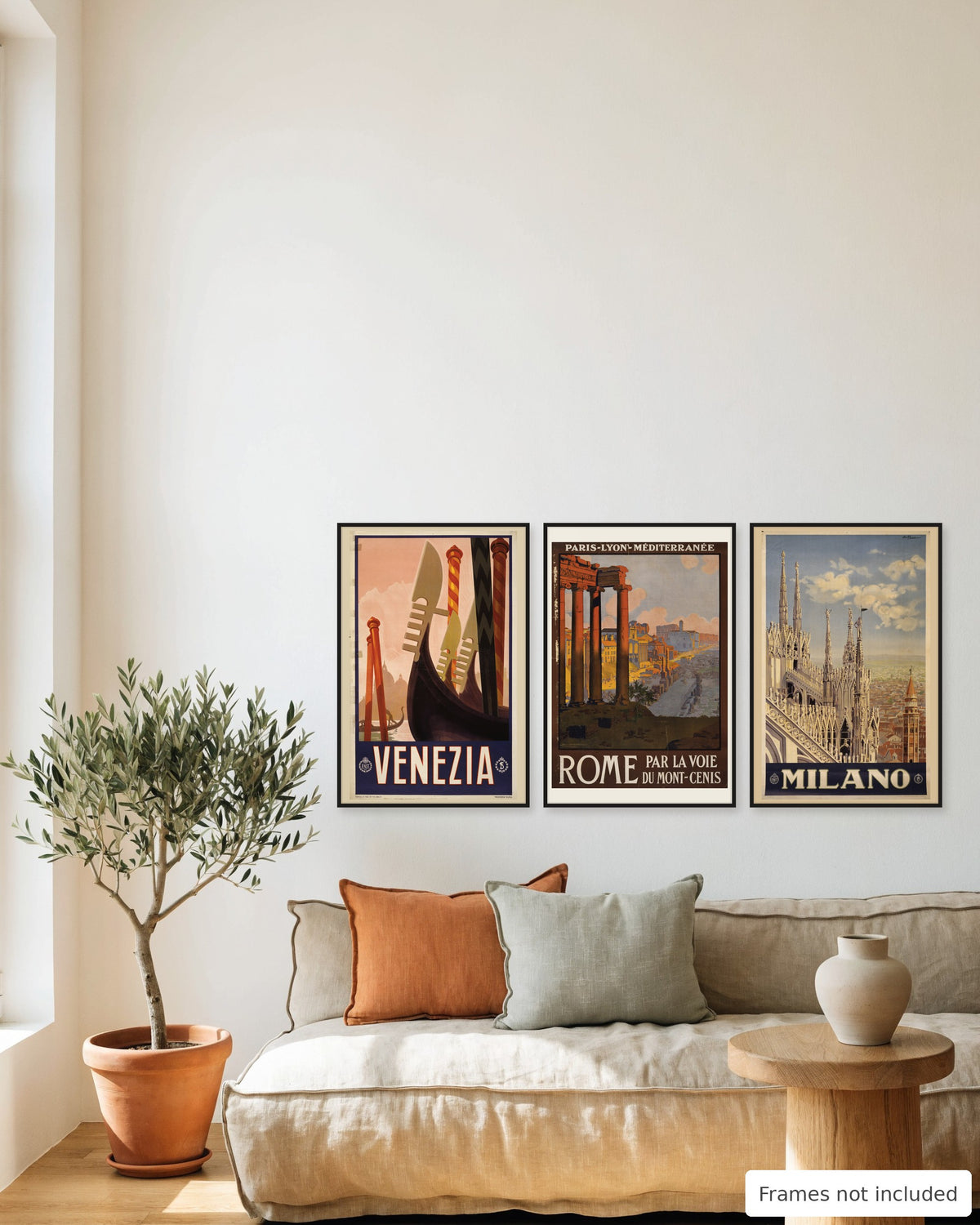 Italy vintage poster set of 3 - Venice, Rome and Milan framed as a gallery wall above a sofa
