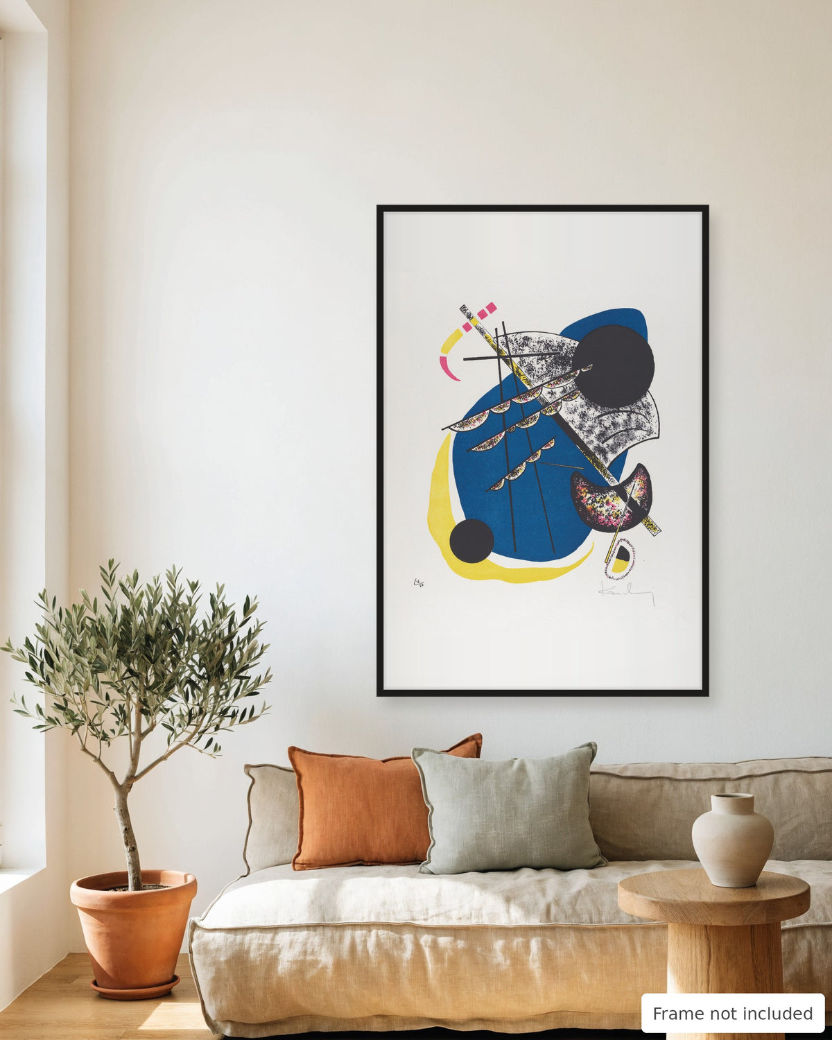 Small Worlds II print by Wassily Kandinsky (1922) framed on a living room wall above a linen sofa