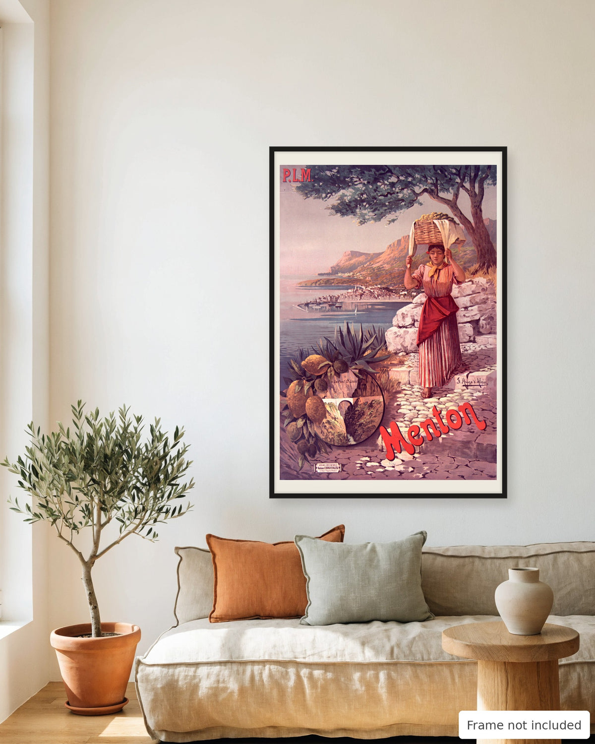 Menton vintage travel poster (1898) framed on a living room wall above a linen sofa