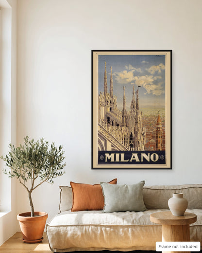 Milan vintage travel poster (1920) framed on a living room wall above a linen sofa
