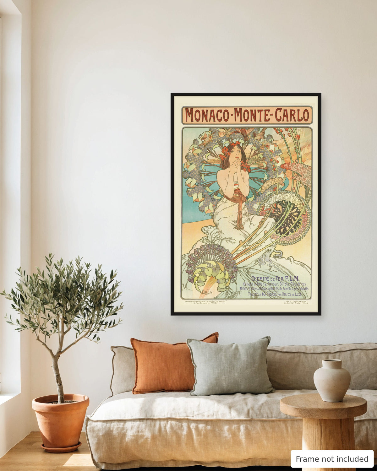 Monaco Monte-Carlo vintage travel poster (1897) framed on a living room wall above a linen sofa