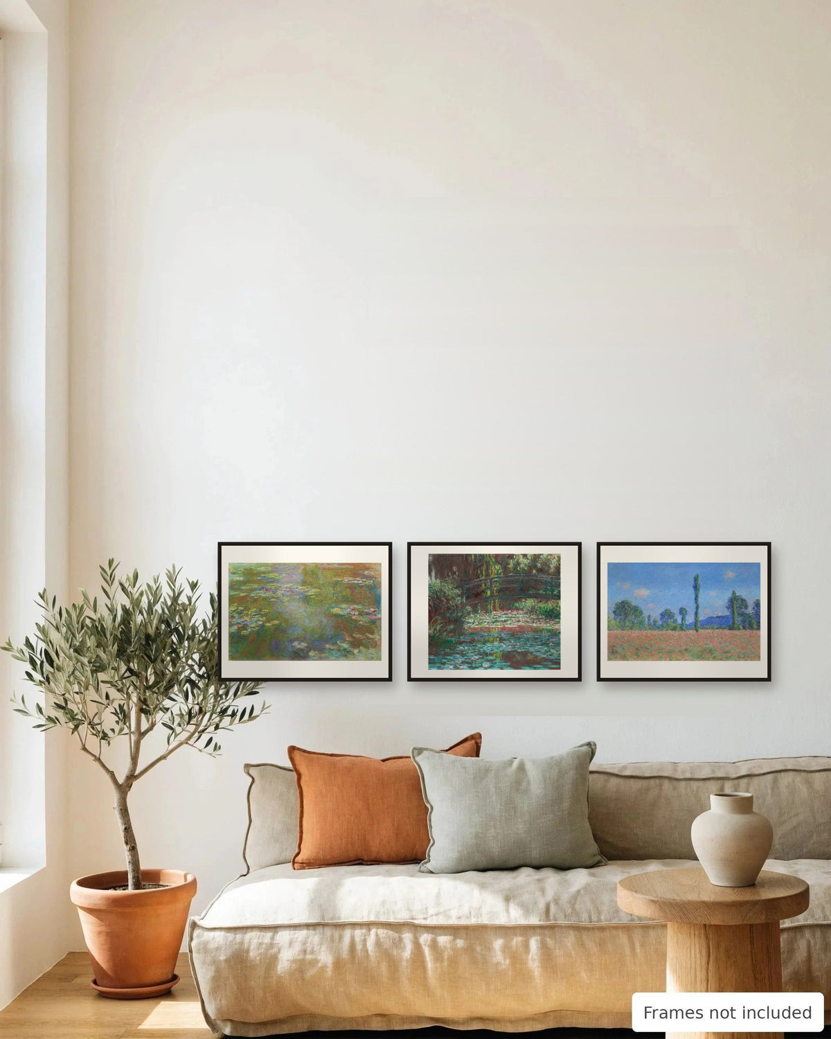 Claude Monet Print Set of 3 framed as a gallery wall above a sofa - frames not included