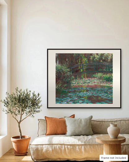 Water Lily Pond with Japanese Footbridge by Claude Monet (1900) framed on a living room wall - frame not included