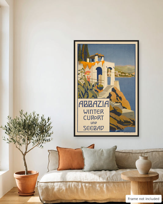 Opatija vintage travel poster (1911) framed on a living room wall above a linen sofa