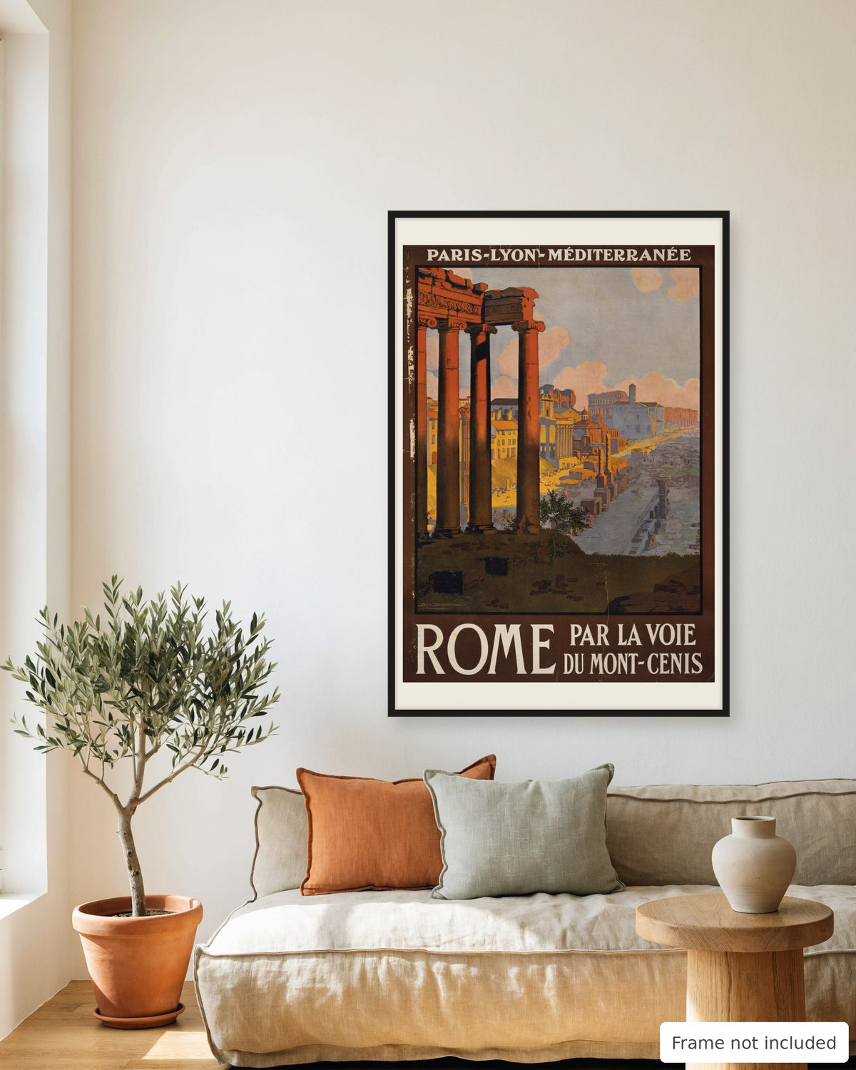 Rome vintage travel poster (1920) framed on a living room wall above a linen sofa