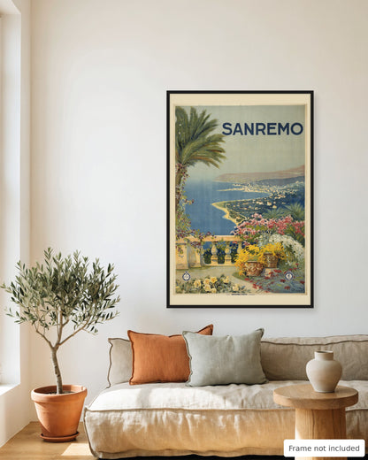 Sanremo vintage travel poster (1920) framed on a living room wall above a linen sofa