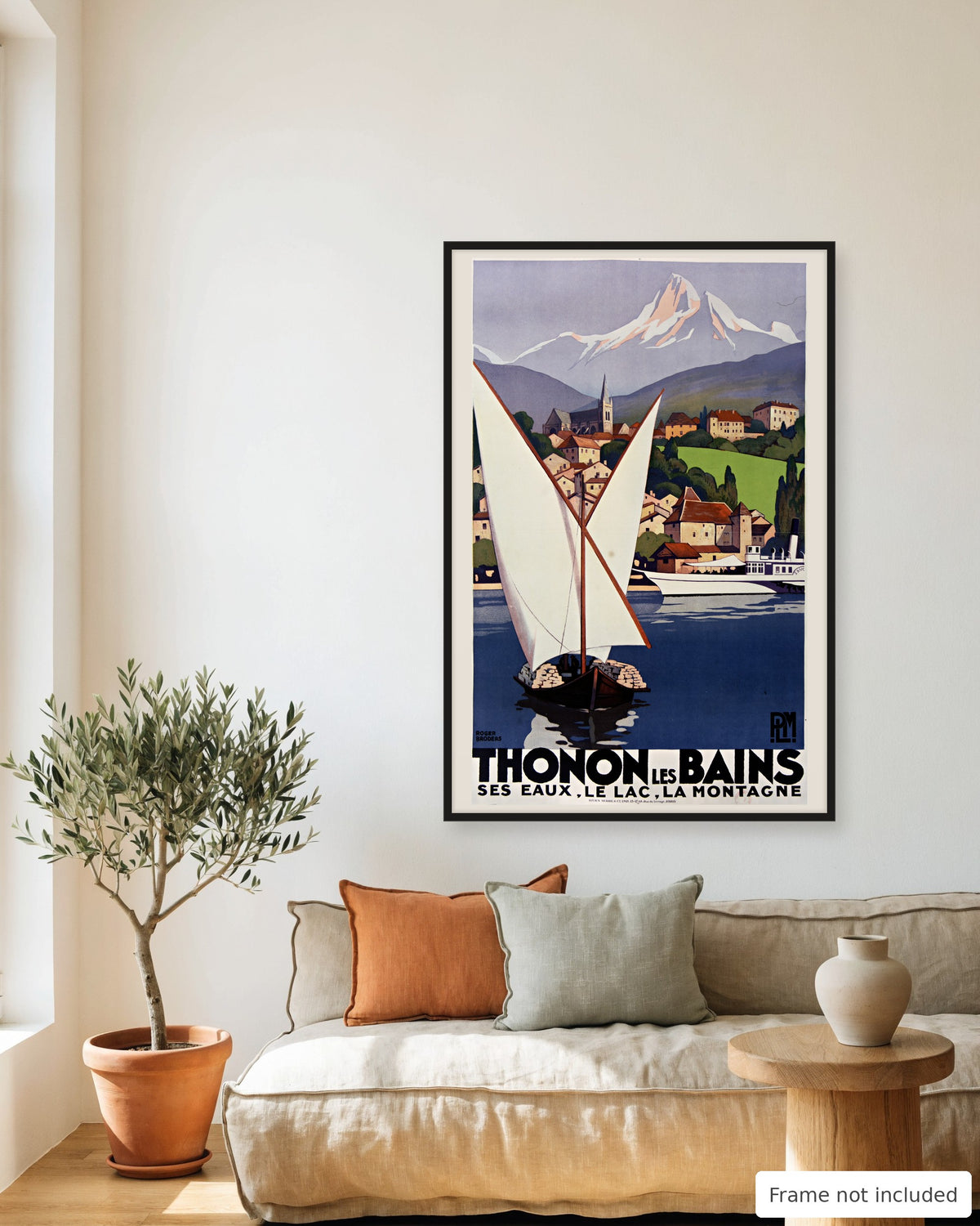 Thonon-les-Bains vintage travel poster (1929) framed on a living room wall above a linen sofa