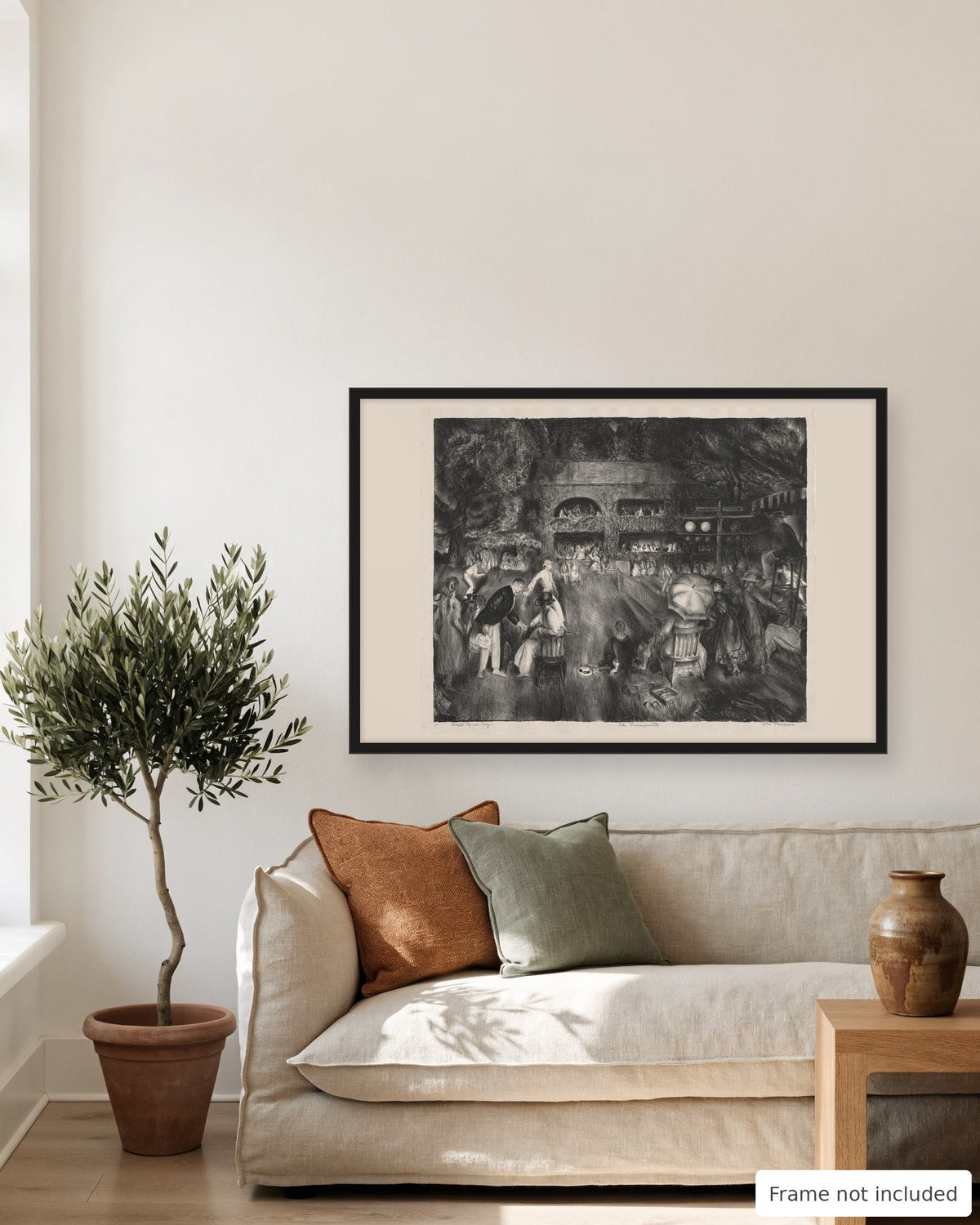 The Tournament by George Bellows 1920 lithograph print in a living room above a linen sofa