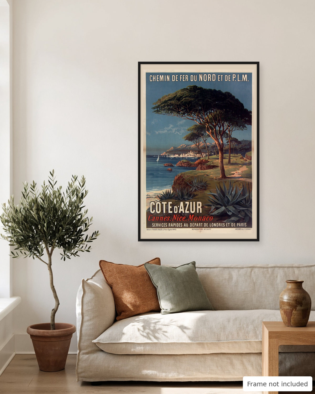 Cote d'Azur vintage travel poster (1897) shown on a living room wall, second view