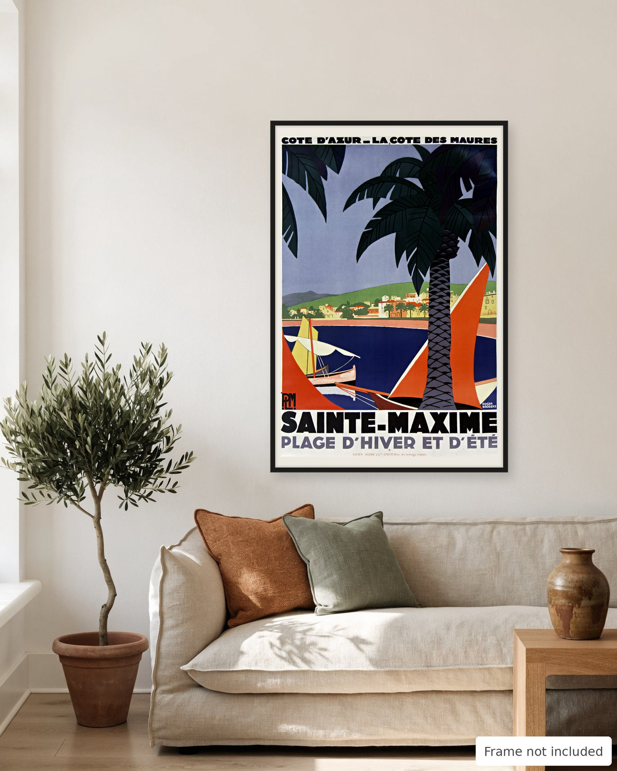 Sainte-Maxime vintage travel poster (1928) shown on a living room wall, second view