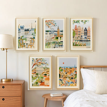 Paris London Amsterdam Rome Barcelona prints above a bed